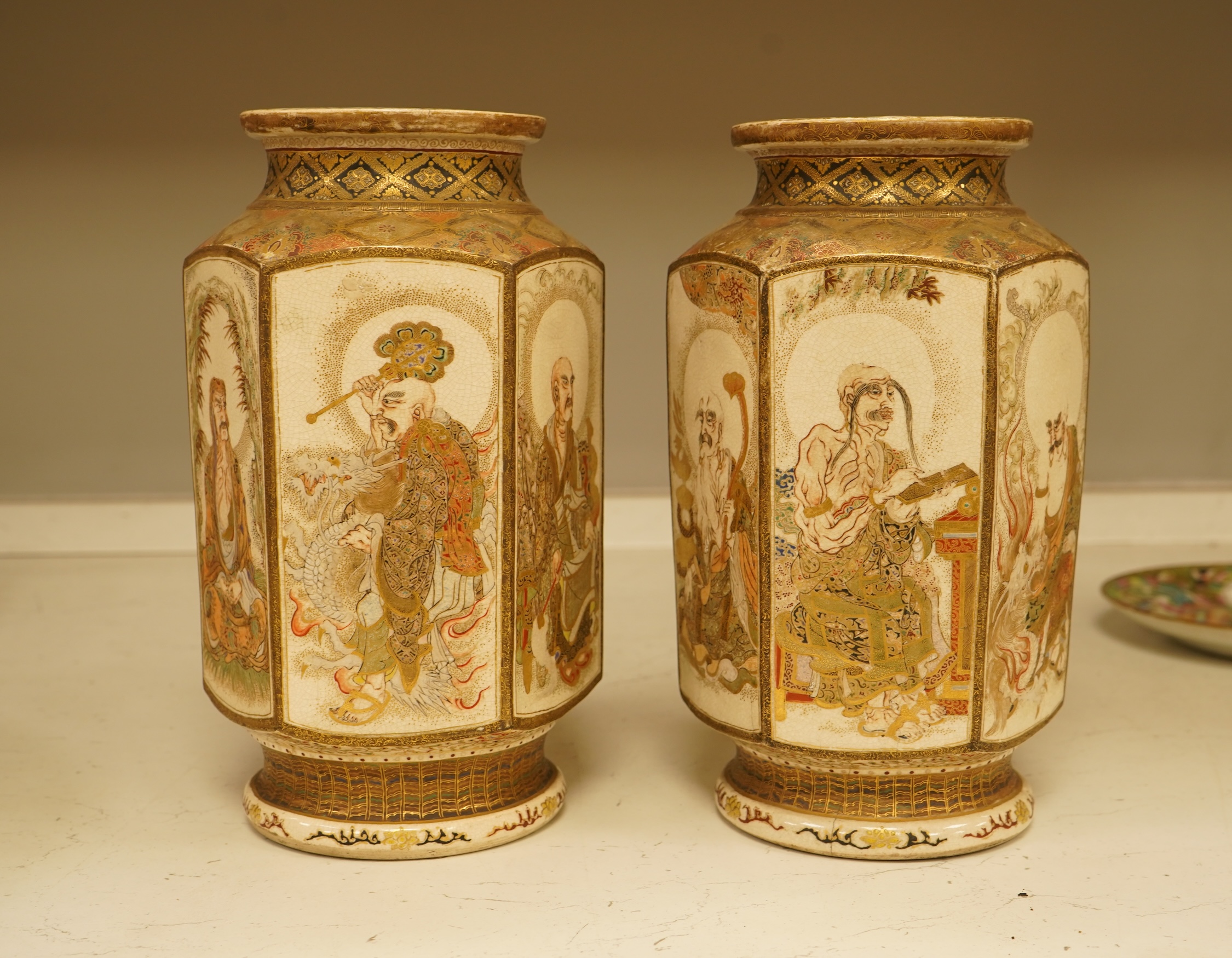 A pair of Japanese Satsuma 'rakan' vases, Meiji period, 26cm high